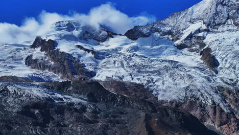 Morning-blue-bird-clear-sky-sunny-glacier-glacial-crevasse-Saas-Fee-Saastal-Zermatt-Switzerland-aerial-drone-gondola-Metro-Alpin-tram-Swiss-Alpine-Alps-chalet-valley-mountains-Feevispa-forward-reveal