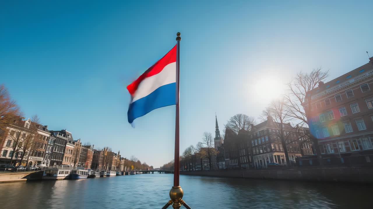 Amsterdam Canal View with Dutch Flag