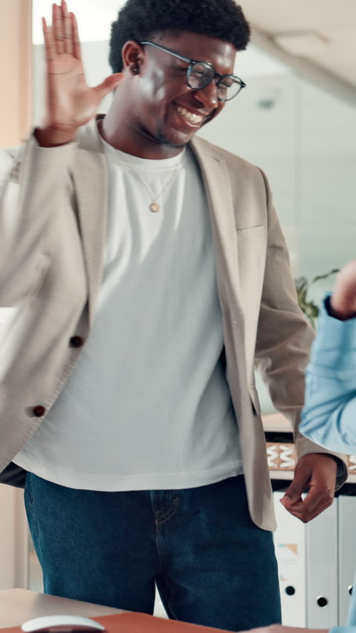 Young Business Colleagues Celebrating Success with a High Five in Office