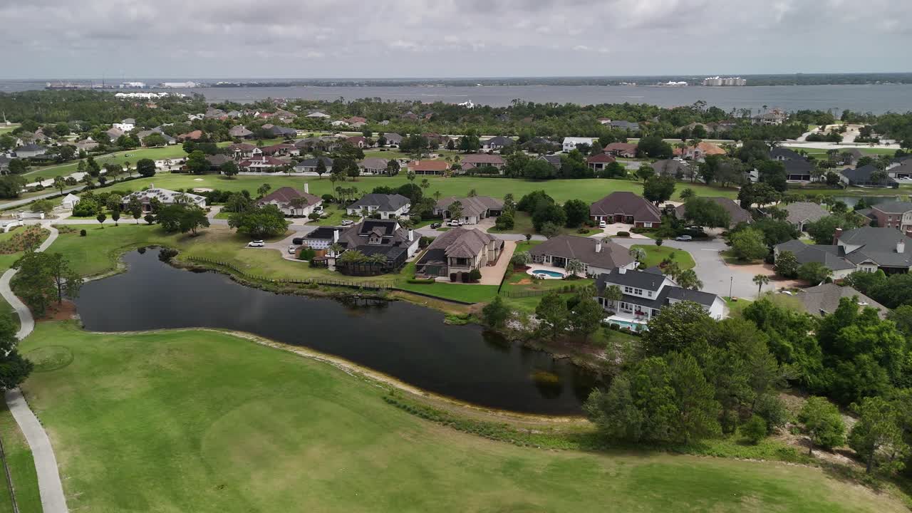 Suburban golf community at residential area with water features and green lawns, Panama City Beach, Florida, USA
