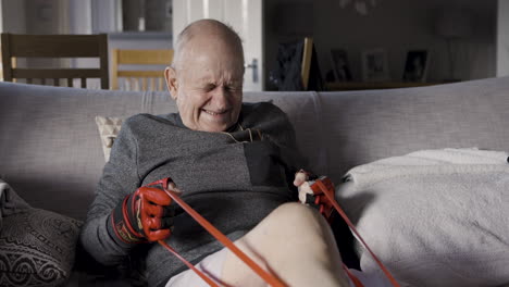 elderly man exercising with resistance band at home