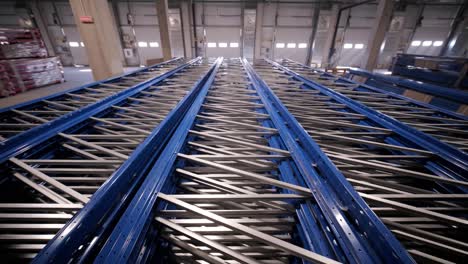 big and modern warehouse under construction, featuring metal shelving and other industrial equipment.