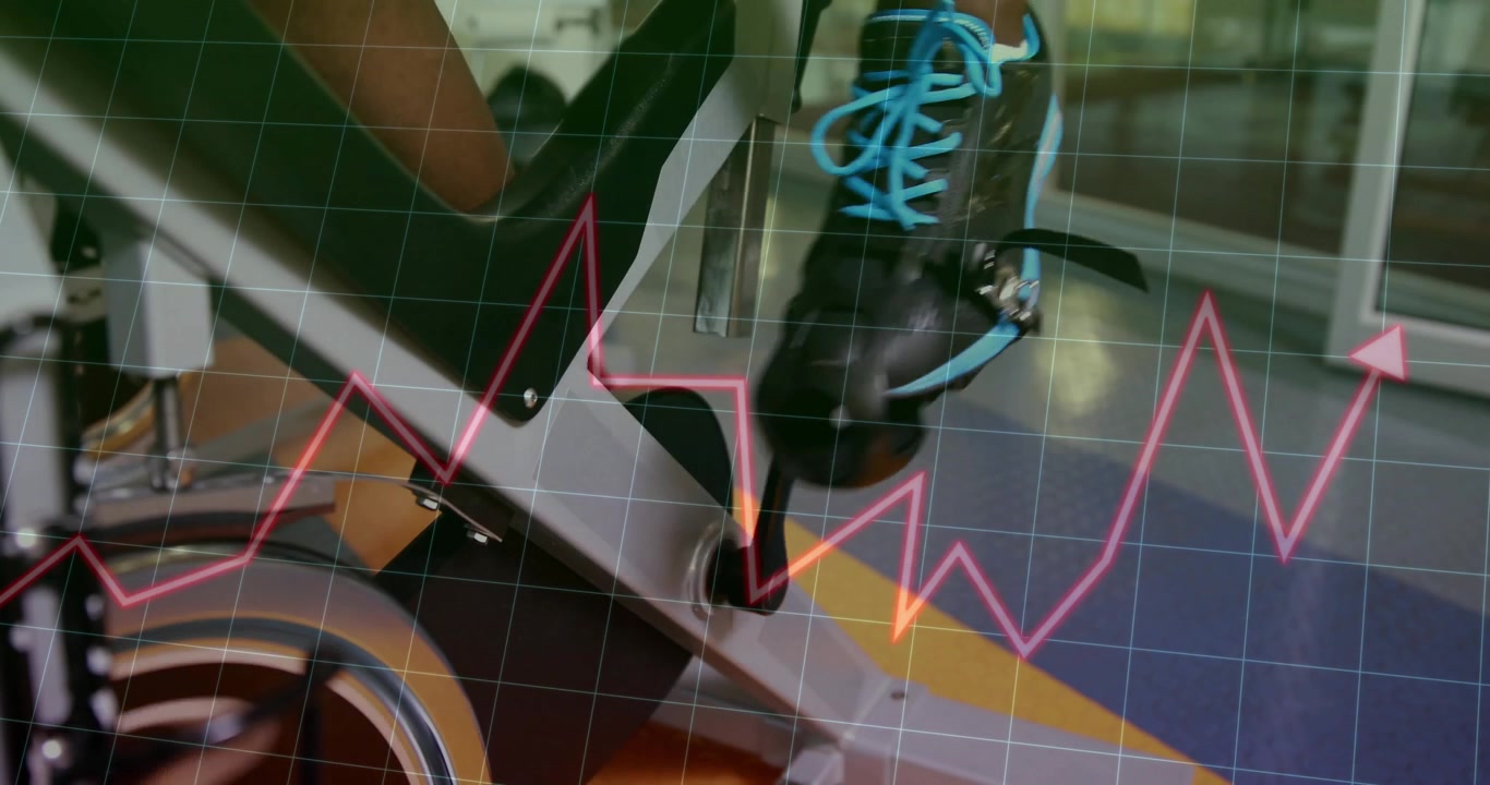 Cyclist clipping shoe into pedal and pedaling gym bike, grid-mapped magenta graph spiking metrics