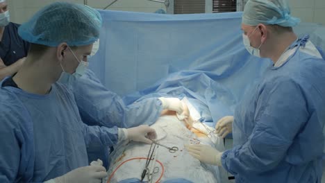 breast augmentation under the guidance surgeons team in surgical operating room