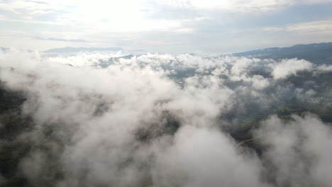 aerial flight over low-lying clouds, scenic skyscape background