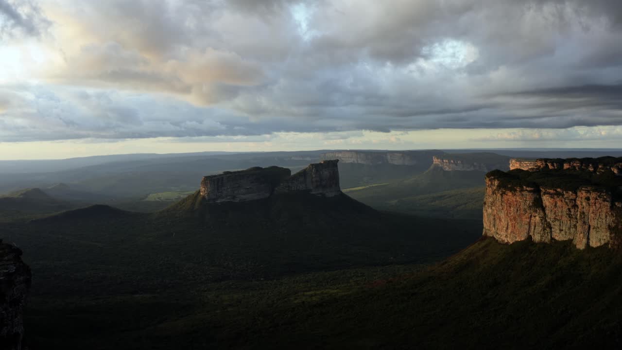 Timelapse of a beautiful drone landscape shot of the stunning Capao Valley from the Mount of Pai Inácio in the Chapada Diamantina national park in northern Brazil on a warm sunny summer evening