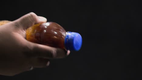 shaking drink bottle closeup 100fps