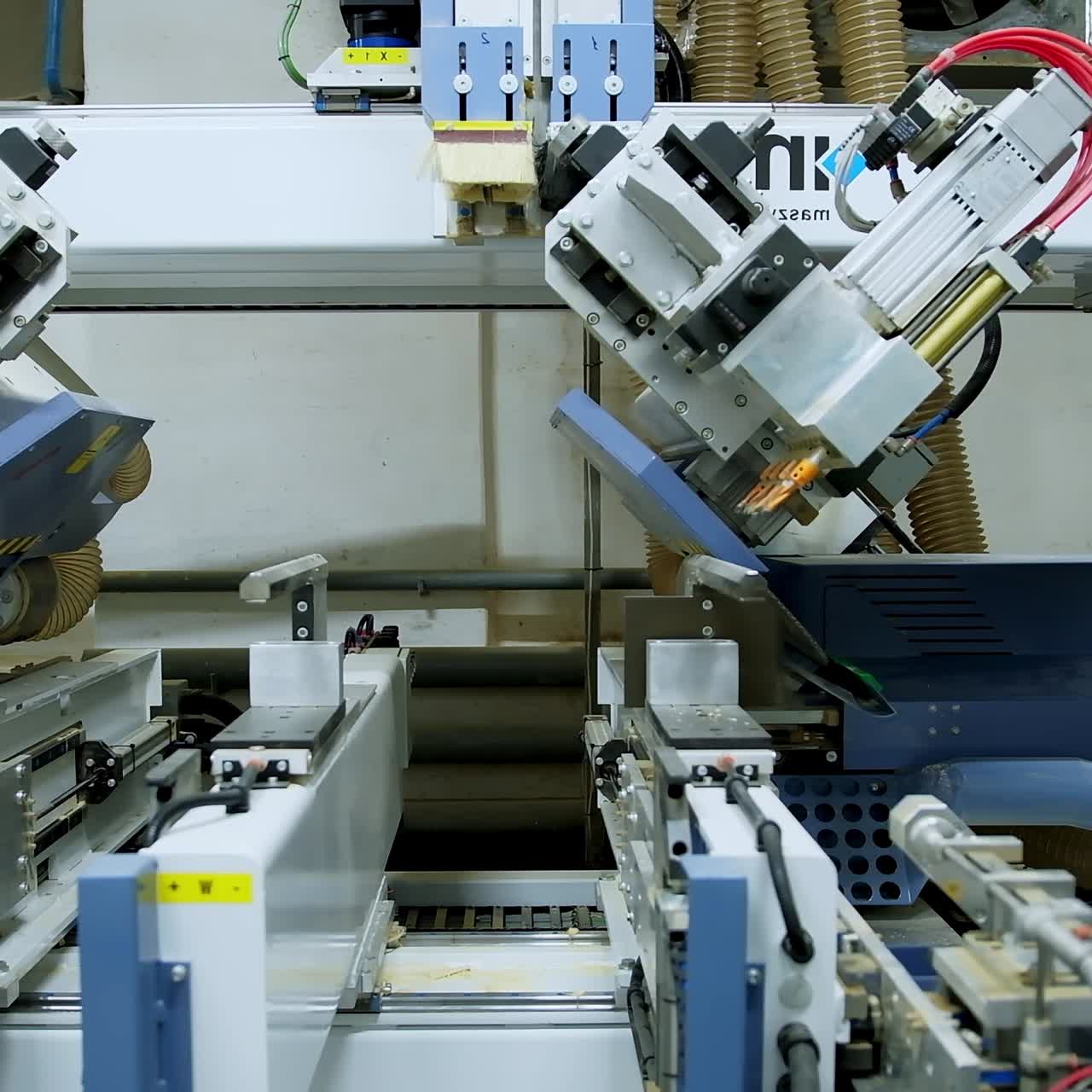 Automated equipment inside the workshop. Modern industrial device for doors production. Door industry concept.