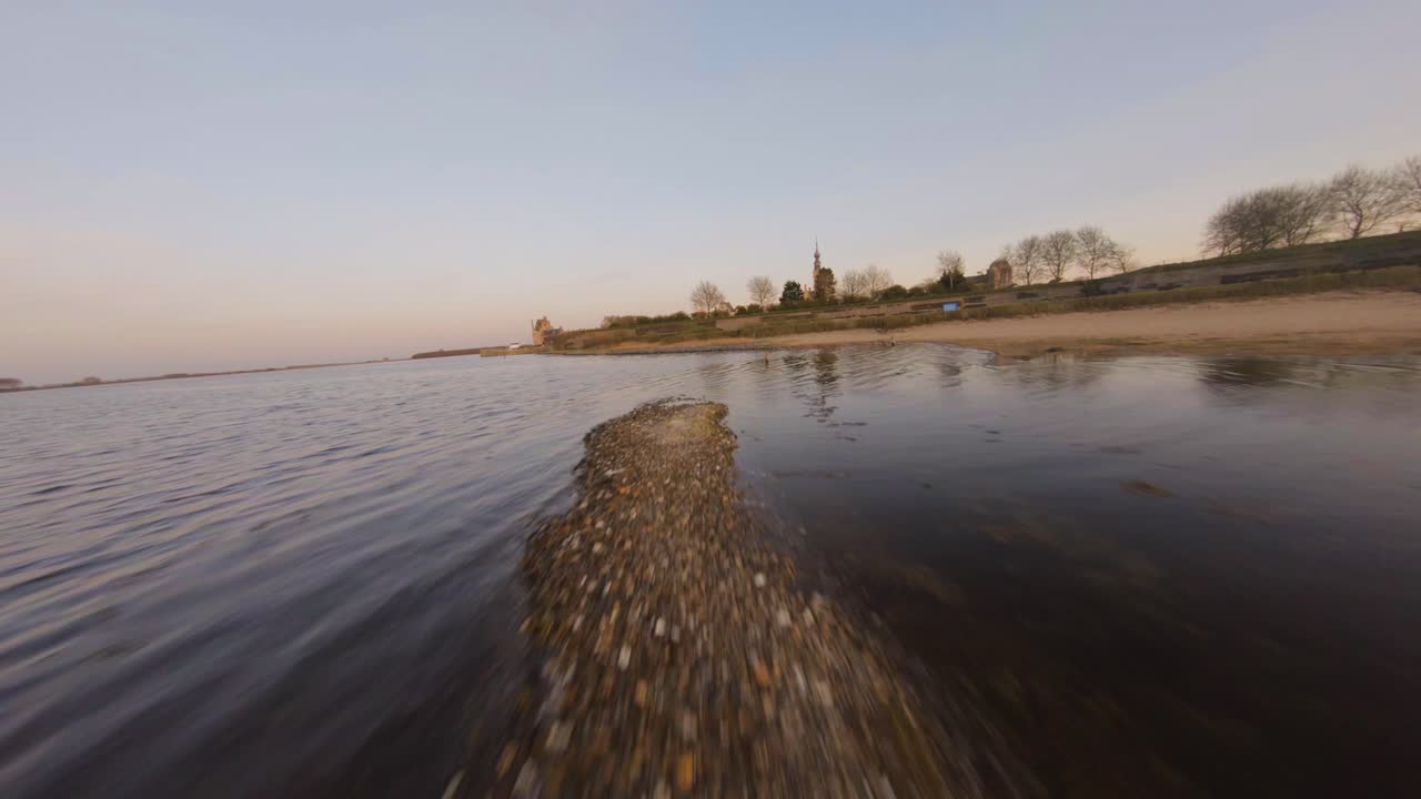 Aerial drone flying over seagulls and lake sandbank in Veere medieval town