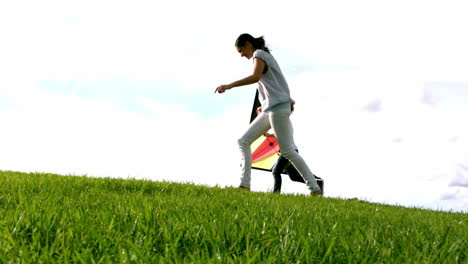 Mother-and-her-daughter-running-with-kite