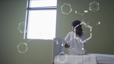 animation of scientific data processing over biracial woman in hospital bed