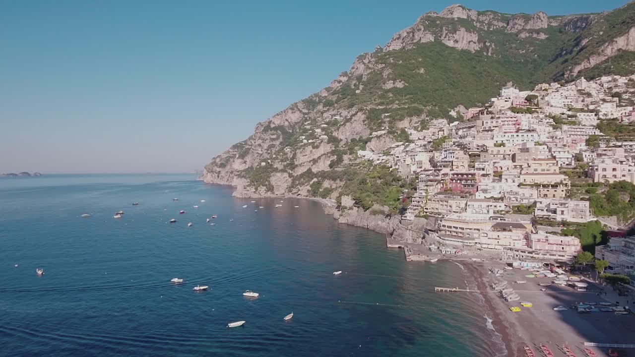 Aerial Drone shot Crane Up looking at Buildings and Beach in Positano, Italy