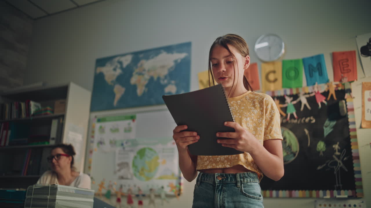 Elementary School Girl Speaking Giving Presentation on Geography in Front of Classmates