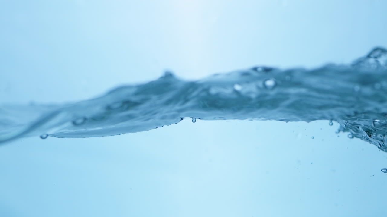 Beautiful slow-motion footage of water waves, highlighting the essential qualities of freshness and clarity in drinking water.