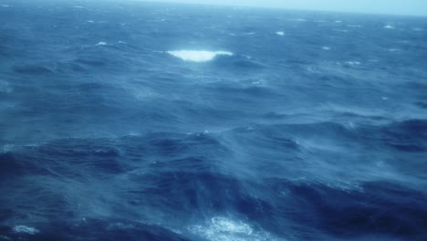 Rough-Choppy-Waves-in-Open-Ocean-at-Sea,-Blue-Water-Swell-Background-on-a-Cruise-Ship-Boat-Trip-Crossing-Drakes-Passage-to-Antarctica,-Across-the-Water-to-Antarctic-Peninsula-from-Ushuaia