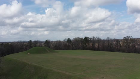 wide reverse pullback aerial shot of the native american religious site emerald mound in mississippi