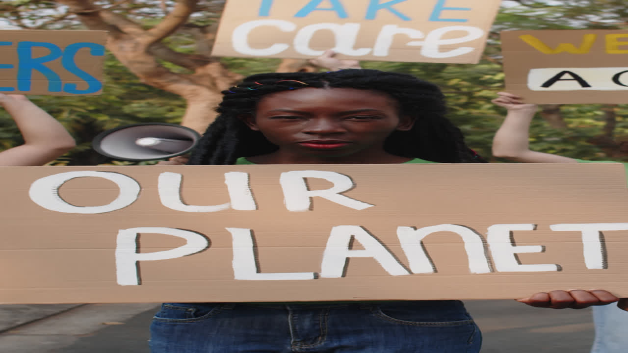 Vertical of Black Woman Taking Part in Eco Protest