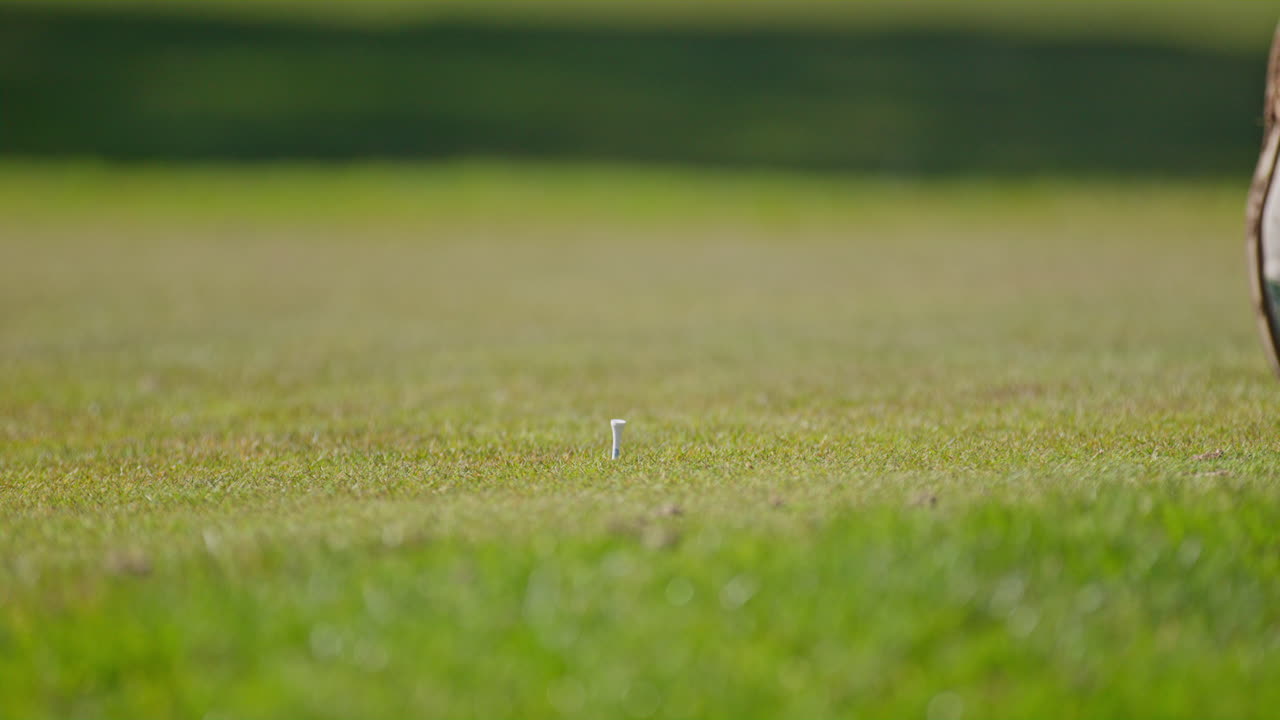 Young golfer playing on a sunny spring day in Switzerland, showcasing precise chipping, putting, bunker, and approach shots. Perfect for sports, lifestyle, and outdoor themes.
