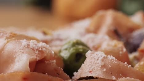 ham italian mordatella, man slices of traditional italian antipasti mortadella sausage on a wooden cutting board, close up macro of chicken or turkey jamon, fat breakfast dish.