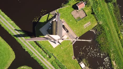 traditional windmill in dutch landscape aerial shot top down birds eye view