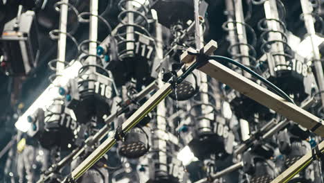 a special effects rain machine in a film cinema studio with a ceiling full of film lights