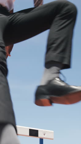 businessman doing hurdle race