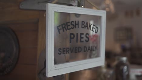 fresh baked pies sign coming into focus in slow motion.