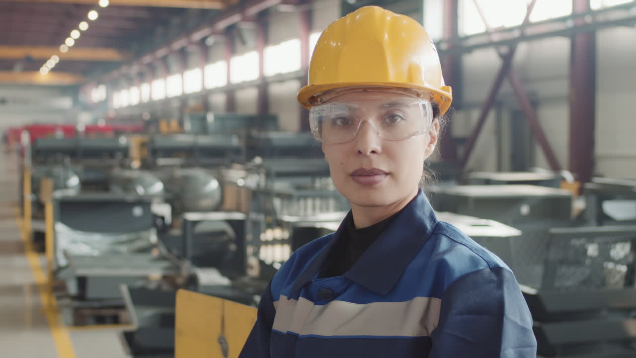Portrait Of Female Factory Engineer In Safety Glasses
