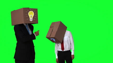 Team-of-businessman-hiding-head-with-box-