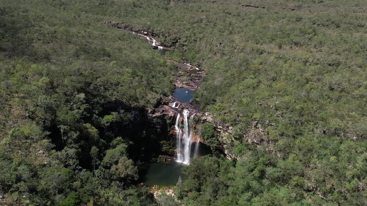 aerial view of the Catedral waterfall and Macaco river in Complexo do Macaco in Chapada dos Veadeiros Goi&aacute;s Brazil, waterfall, rocks and vegetation of the cerrado