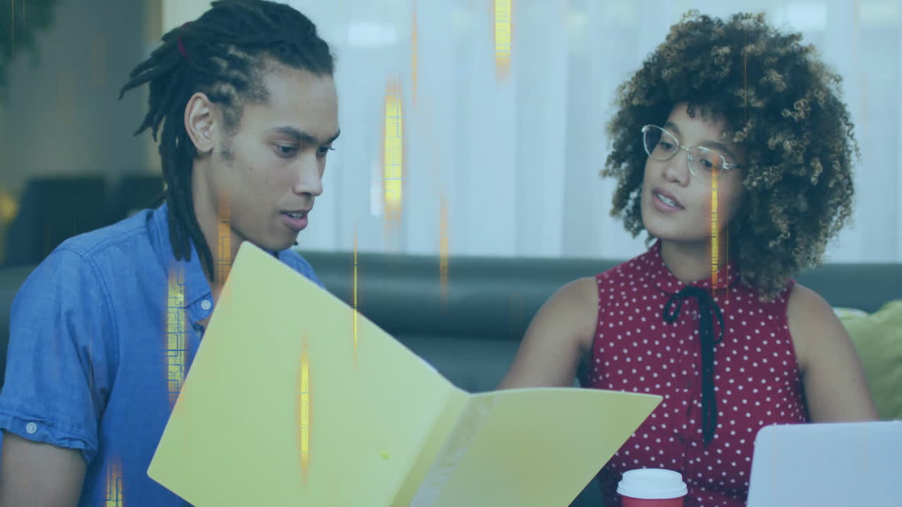 Two people discussing documents with data processing animation over them