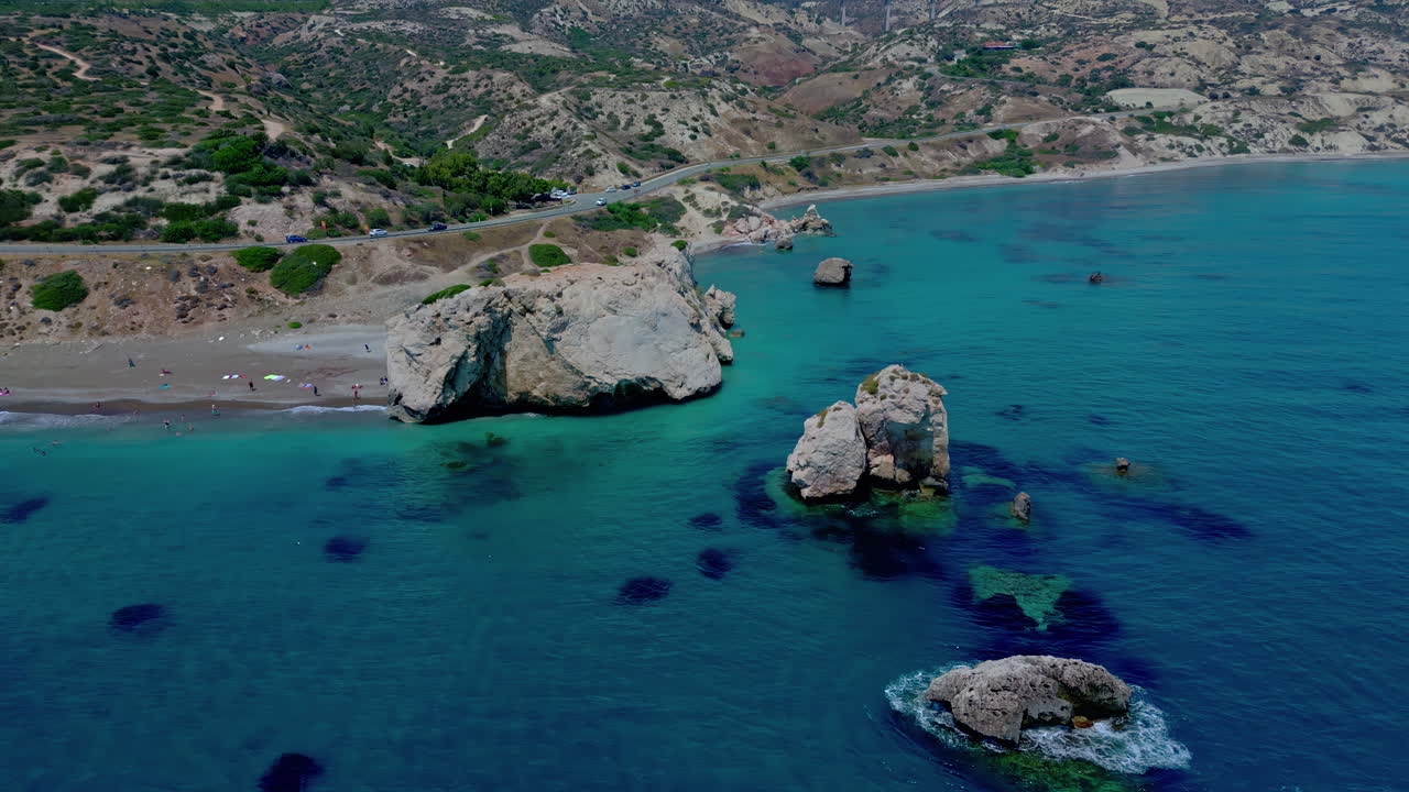 Aerial drone zoom-out shot of famous Aphrodite's Rock Viewpoint