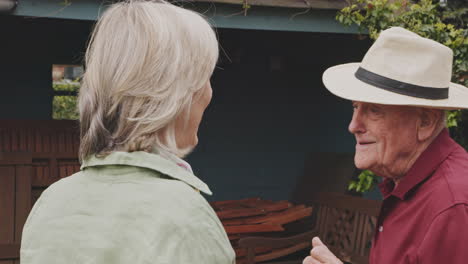 senior couple enjoying a chat in the garden