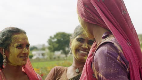 multi ethnic people celebrating the festival of colors holi in india