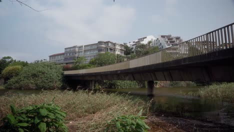 Angle-up-from-below-bridge-of-traffic-crossing-bridge