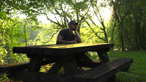 waiting for something to happen at the picnic table