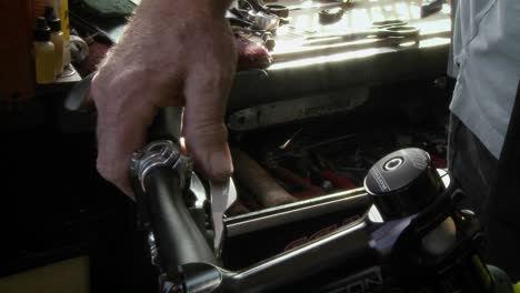 A-man-is-repairing-a-part-on-the-handlebar-of-a-bicycle