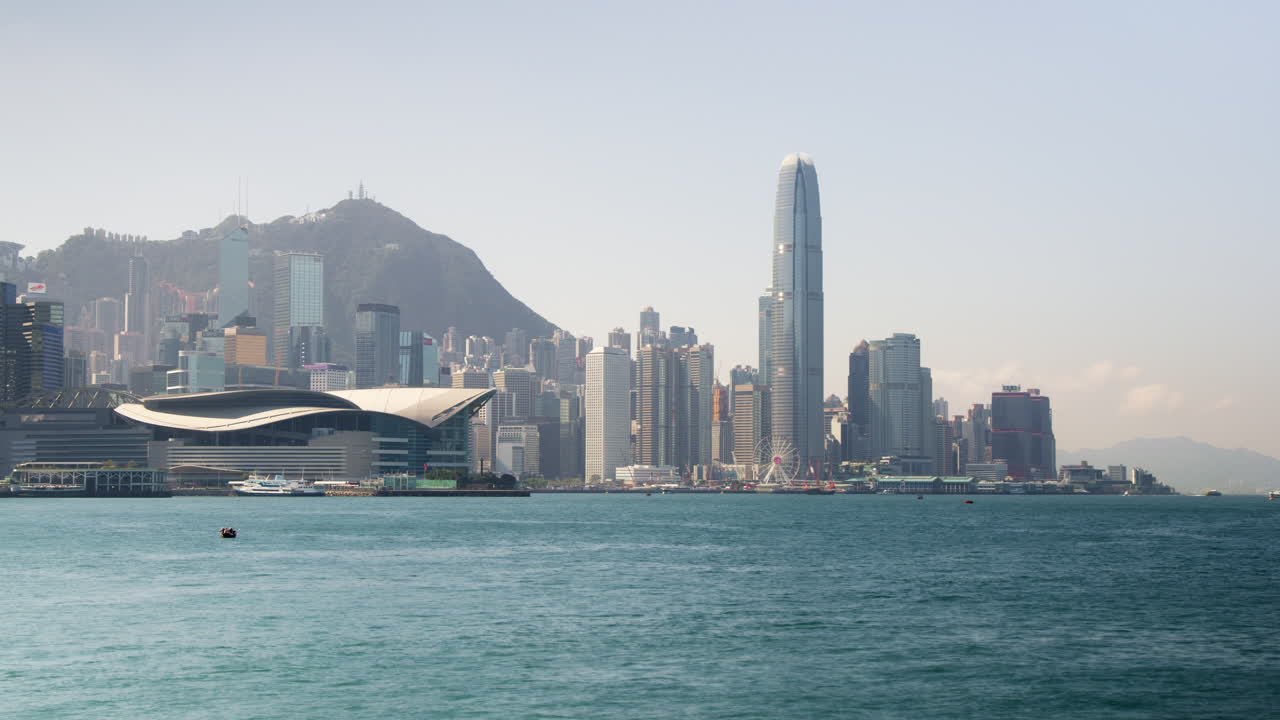 timelapse de hong kong el horizonte de la ciudad de victoria harbour con rascacielos del distrito comercial