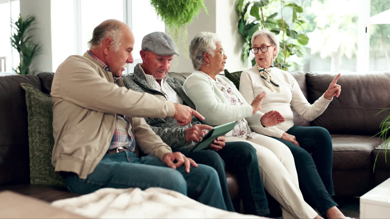 Group of seniors socializing and using technology