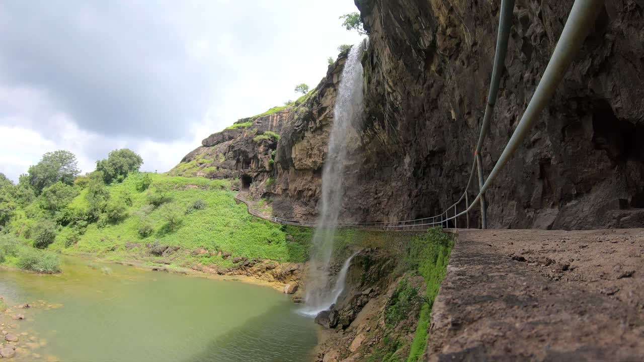 Timelapse at Ellora caves with waterfall, UNESCO World Heritage Site, Maharashtra