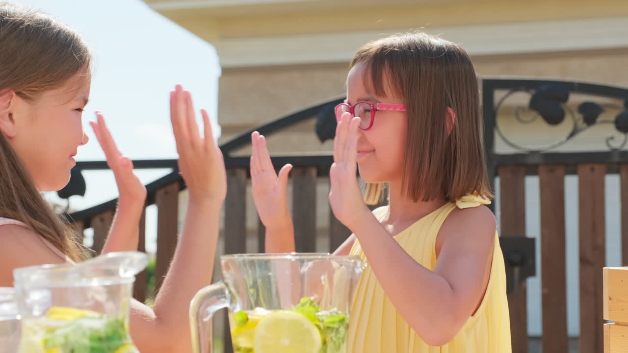 Joyful Girls Selling Lemonade On Summer Day