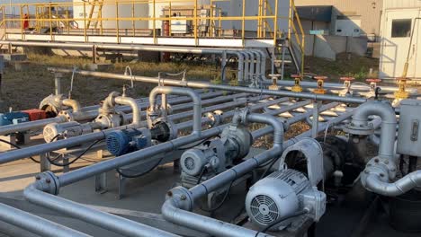 close-up-shot-of-fuel-pipes-and-large-storage-containers