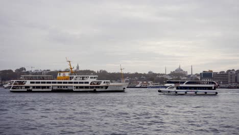 touristic boats passing by with istanbul in the background