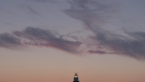 tilt down shot of famous dutch westhoofd lighthouse at zeeland, aerial