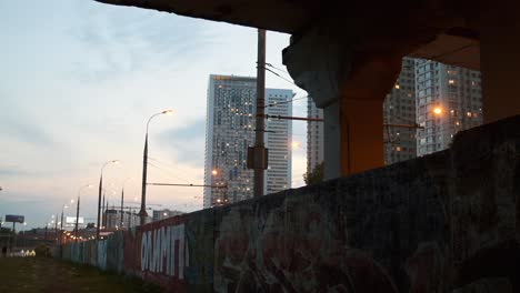 cityscape underpass at dusk with graffiti