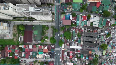 dense residential area in west crame, quezon city, philippines, showcasing varied rooftops, streets, and urban planning, aerial view