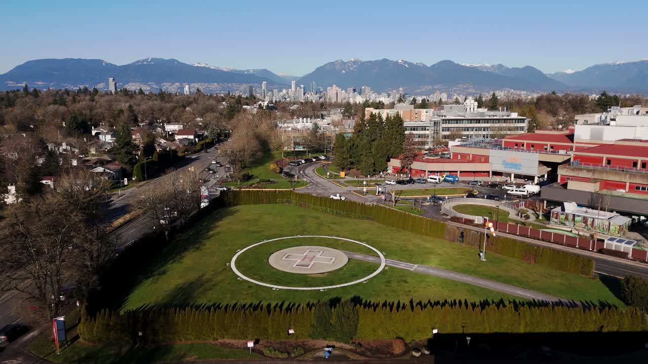 Ground-Level Landing Pad Of The B.C. Women's Hospital And Health Centre In Vancouver, Canada. Aerial Ascending Shot