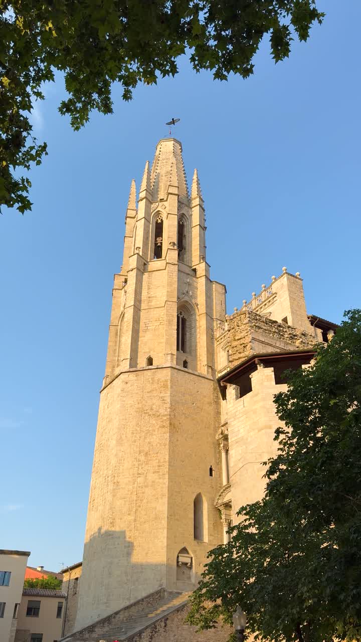 Vertical video of the Basilica of San Félix during golden hour in Girona Spain