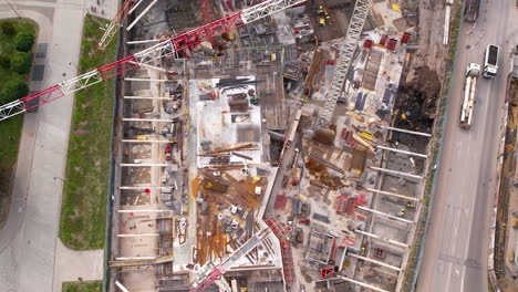 aerial top down shot of construction site with crane during daytime in gdansk