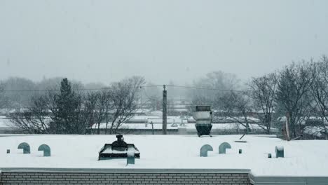Electric-Cable-behing-Urban-Snowy-Rooftop-with-Chimneys-4K
